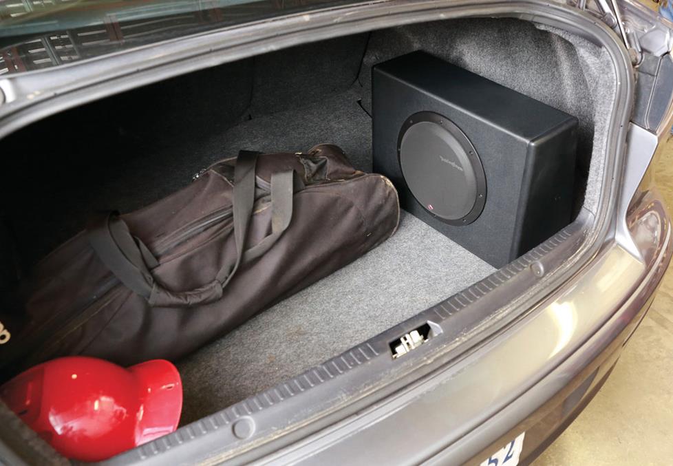 The Rockford Fosgate powered subwoofer mounted in the trunk